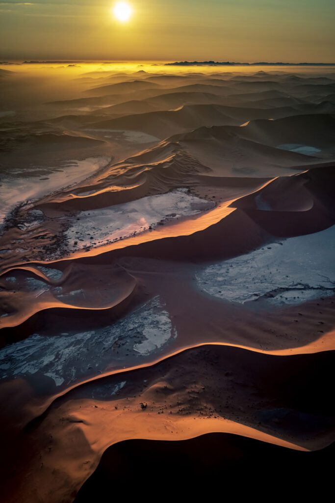 overhead view of sand dunes at sunrise