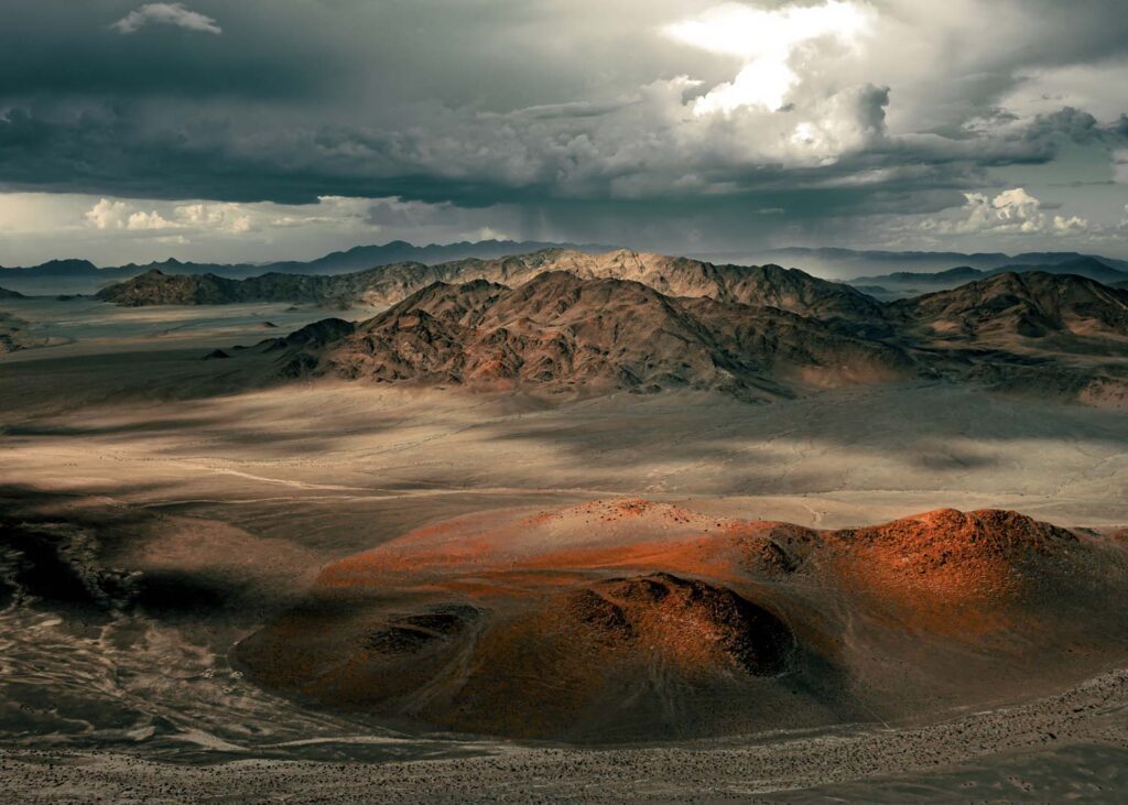 overhead view of sand dunes and mountains